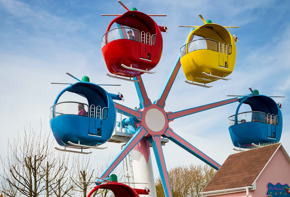 Families riding Miss Rabbit’s Helicopter Ride in Peppa Pig World at Paultons Park