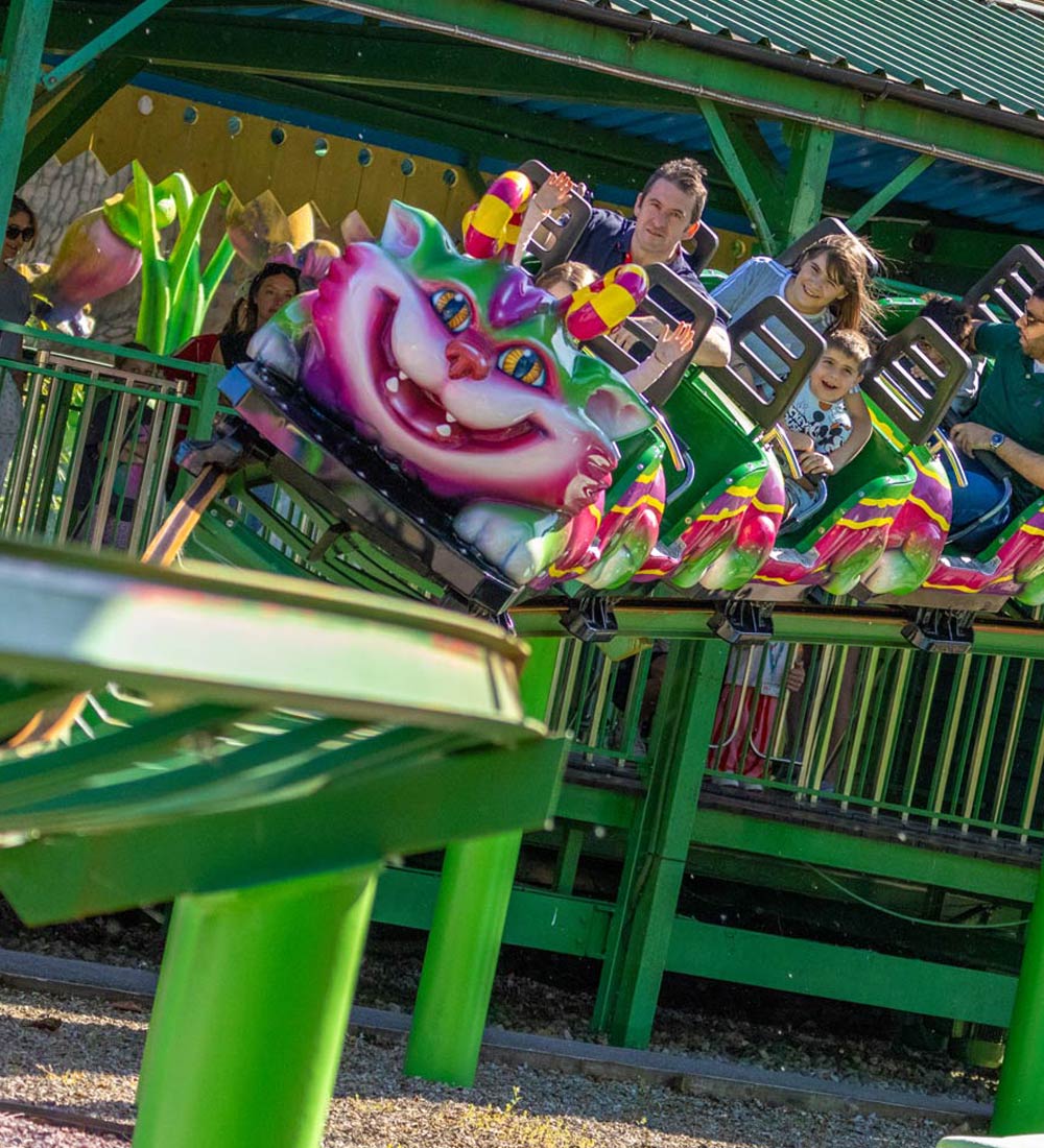 Family riding the Cat-O-Pillar rollercoaster in Critter Creek at Paultons Park