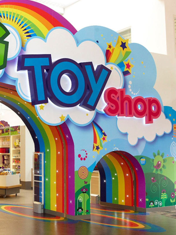 Colourful Toy Shop entrance with rainbow arch at Paultons Park