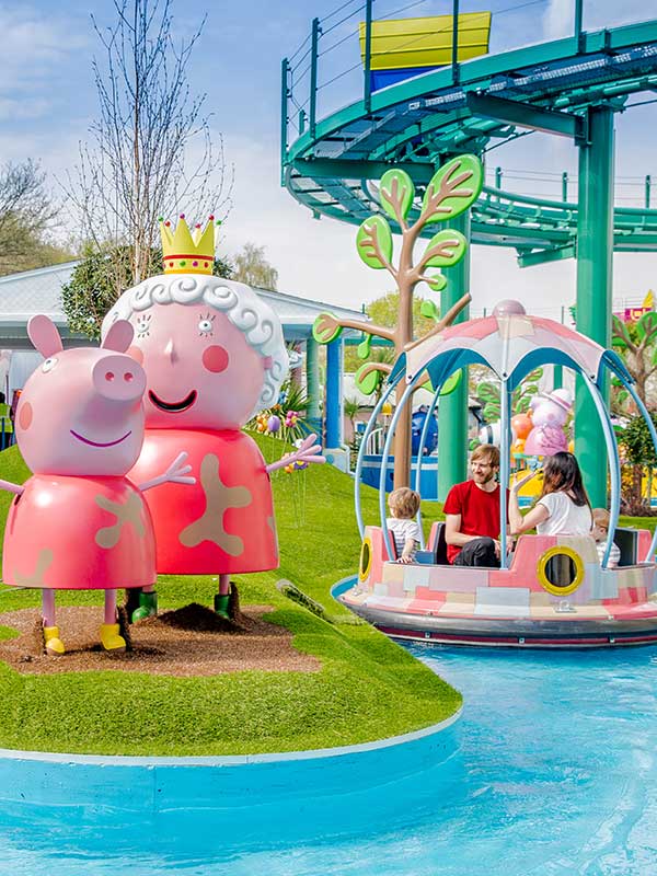 Family enjoying Grampy Rabbit’s Sailing Club boat ride in Peppa Pig World at Paultons Park