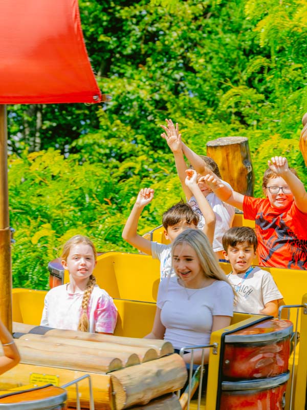Kids riding the Kontiki swinging boat ride at Paultons Park enjoying a fun family thrill attraction