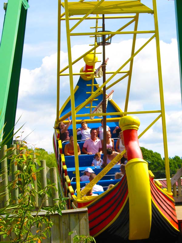 Guests riding the Pirate Ship attraction at Paultons Park on a sunny day