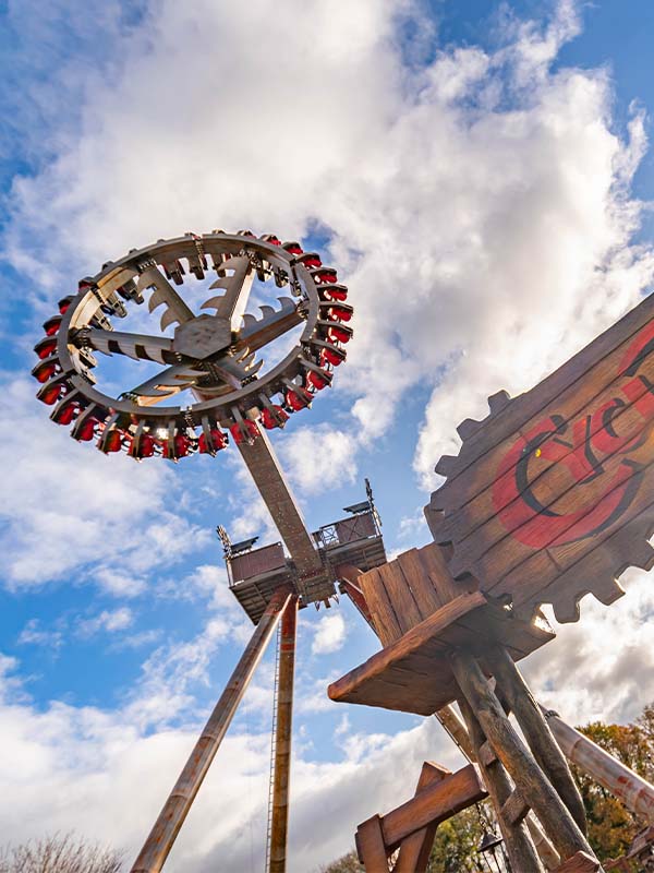 Cyclonator at Paultons Park rotating high in the sky with guests seated around the circular gondola