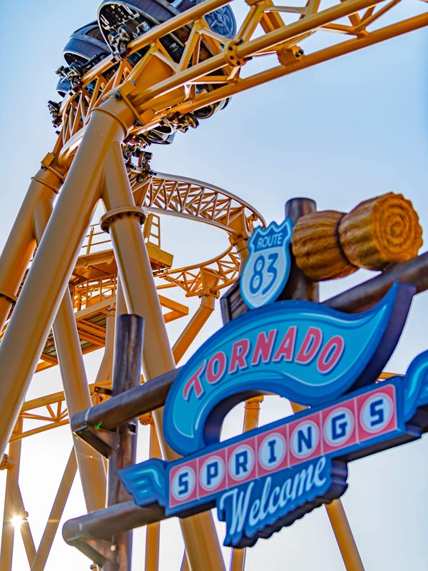 Storm Chaser spinning coaster train climbing yellow track at Paultons Park
