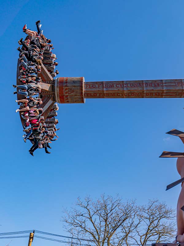 Cyclonator at Paultons Park towering vertically as riders experience high-speed spinning thrills