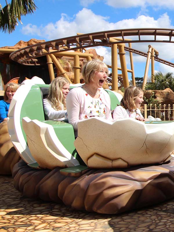 Family riding Boulderdash dinosaur egg car at Paultons Park