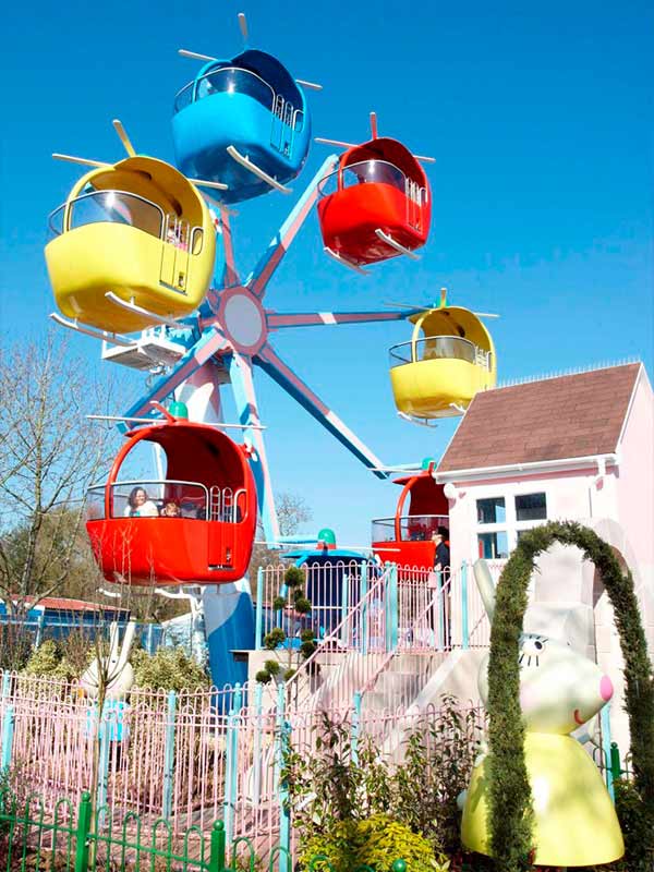 Helicopter cabins circling the central tower on Miss Rabbit's Helicopter Flight at Peppa Pig World in Paultons Park