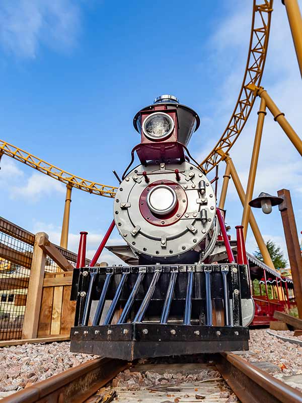 Front view of Rio Grande Train Ride locomotive at Paultons Park on gravel railway track