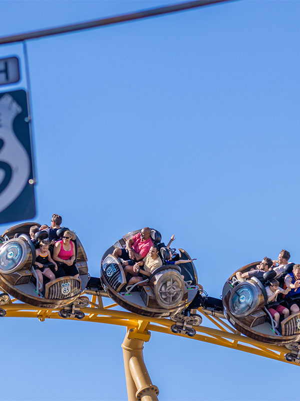 Storm Chaser roller coaster cars spinning high above Tornado Springs at Paultons Park