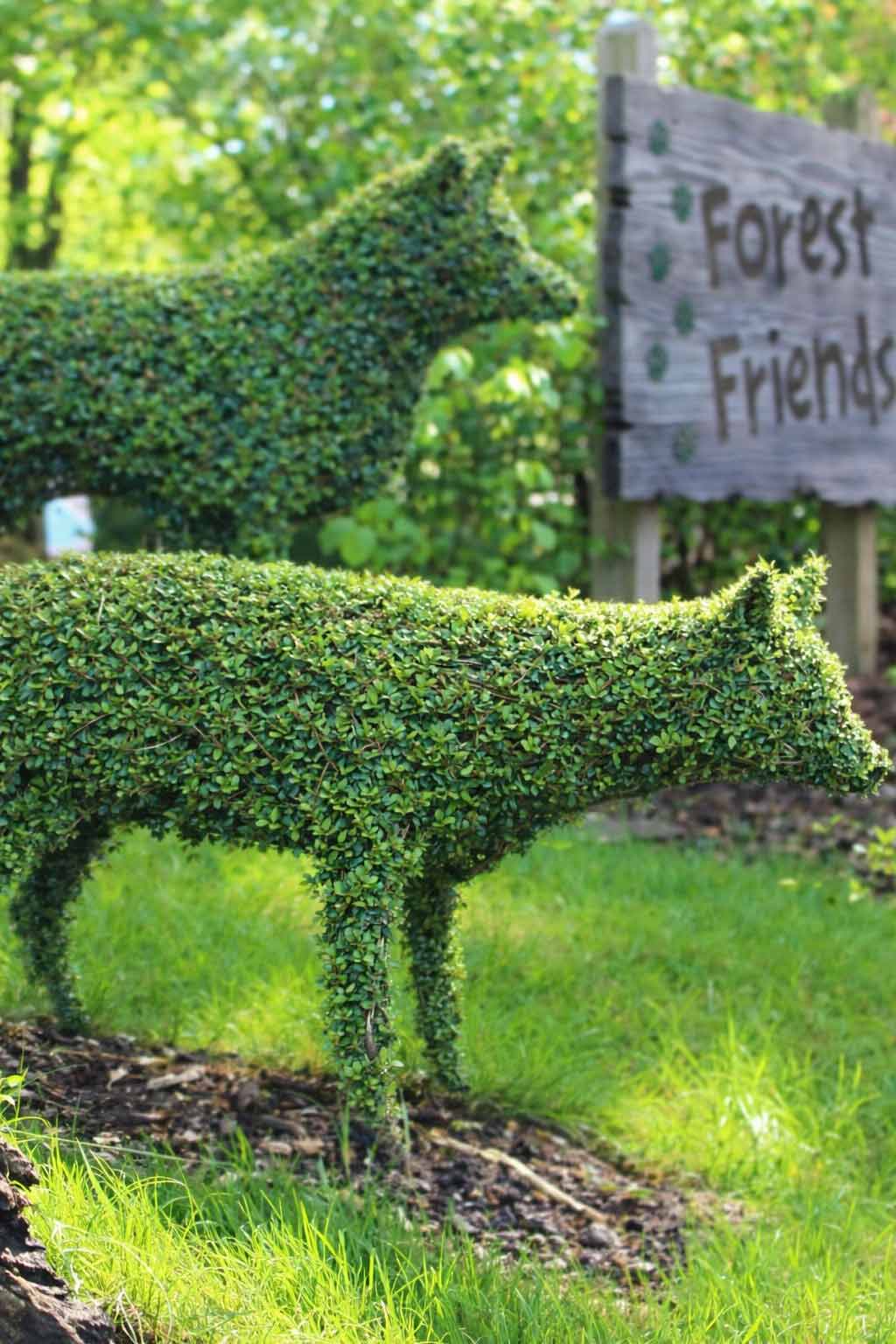 Topiary woodland animals beside Forest Friends sign in Forest Friends Garden at Paultons Park