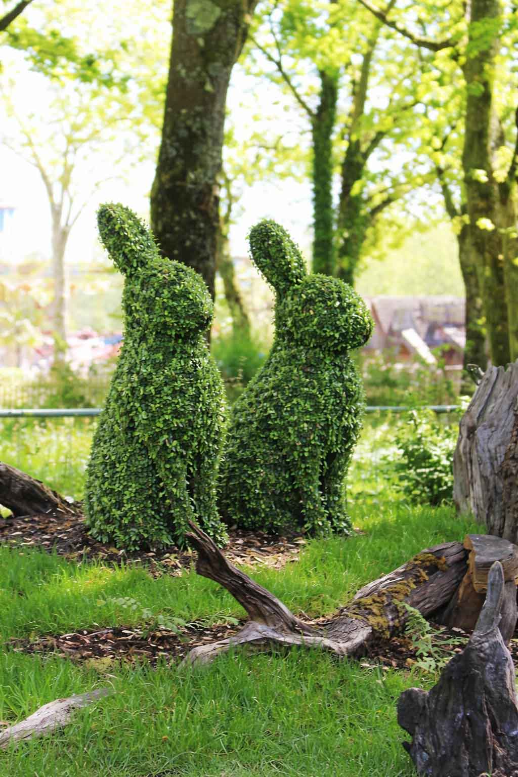 Topiary fox sculpture near Forest Friends sign in Forest Friends Garden at Paultons Park