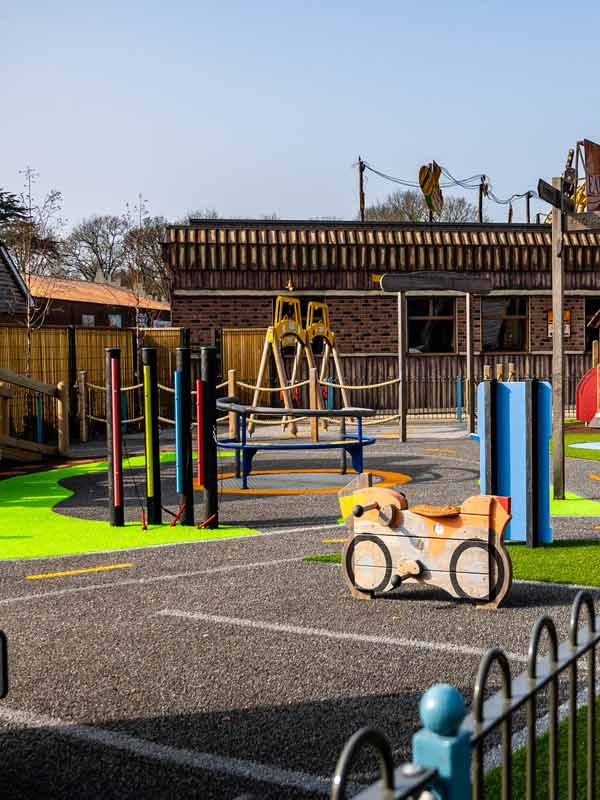 Road themed playground with steering wheels and play vehicles in Parking Lot Tots Play Area at Paultons Park
