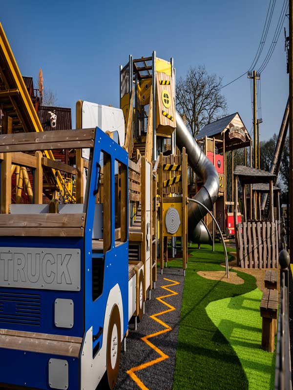 Junkyard Junction play area with themed fire truck and climbing structure at Paultons Park