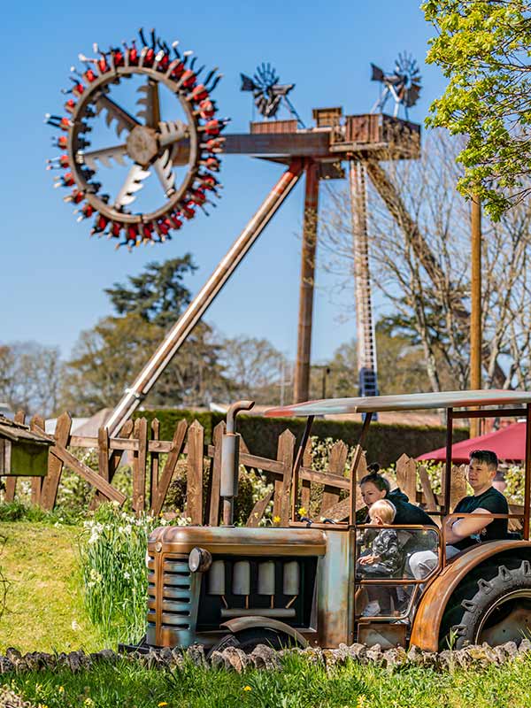 Family enjoying the Trekking Tractors ride at Paultons Park in a vintage style tractor vehicle