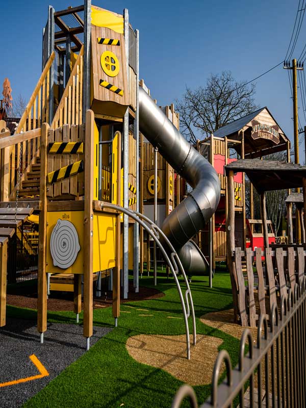 Junkyard Junction play tower with metal tube slide at Paultons Park