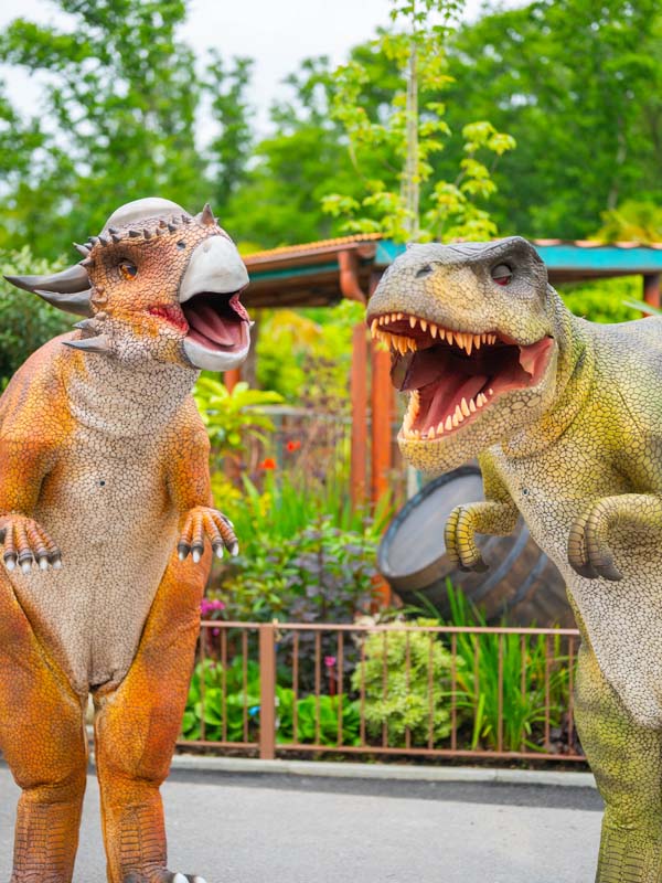 Two realistic dinosaurs facing each other at Alive! Dinosaur Encounter in Lost Kingdom at Paultons Park