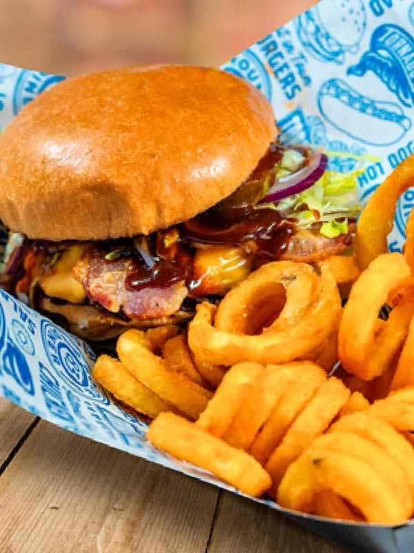 BBQ bacon cheeseburger with melted cheese, bacon and curly fries at Route 83 Diner in Paultons Park