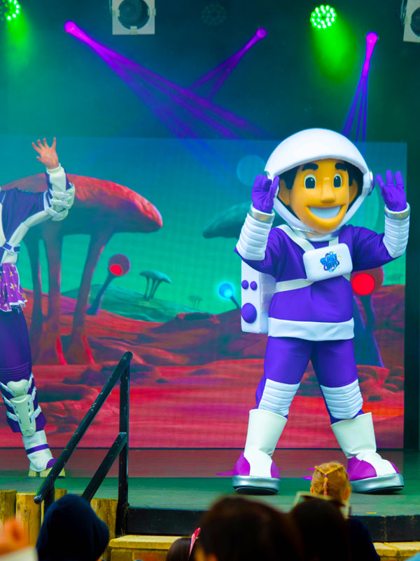 Astronaut and dancers performing on stage during the Blast Off Summer Show at Paultons Park