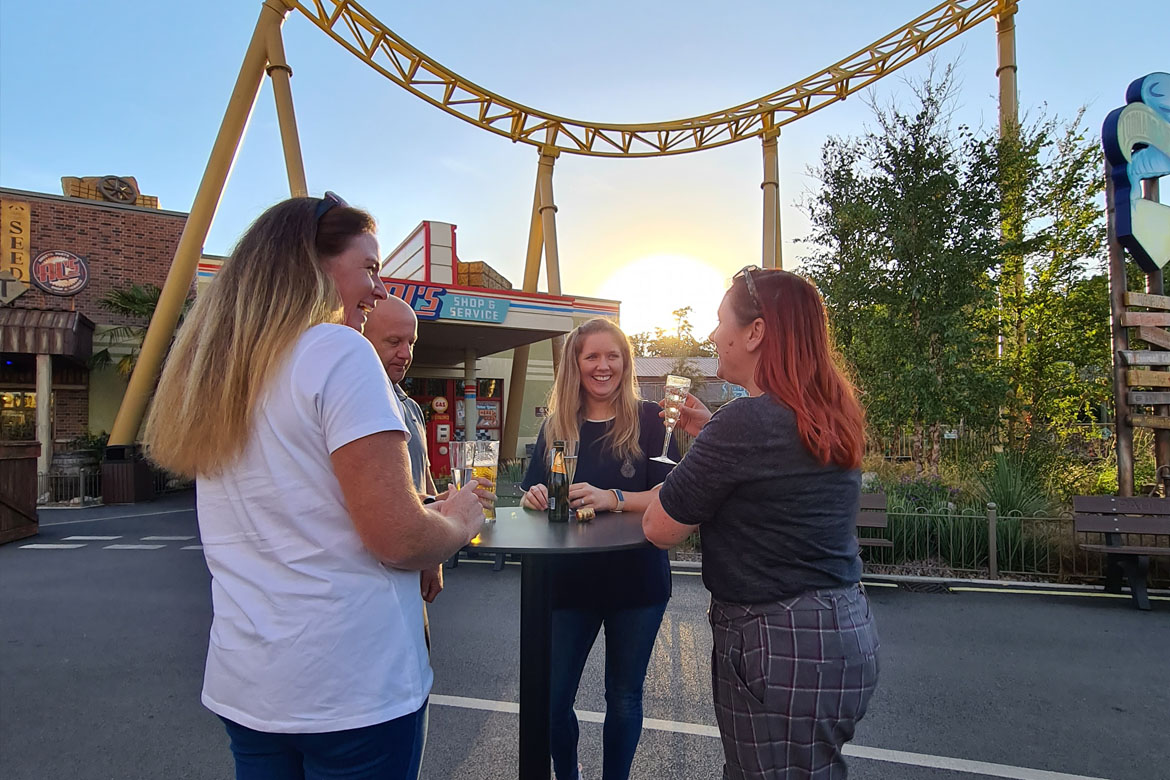 Guests enjoying drinks during an exclusive evening hire event in the Storm Chaser area at Paultons Park.