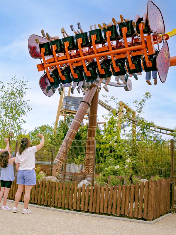 Guests riding Vild Swing at Paultons Park as the giant swing tilts overhead in Valgard.