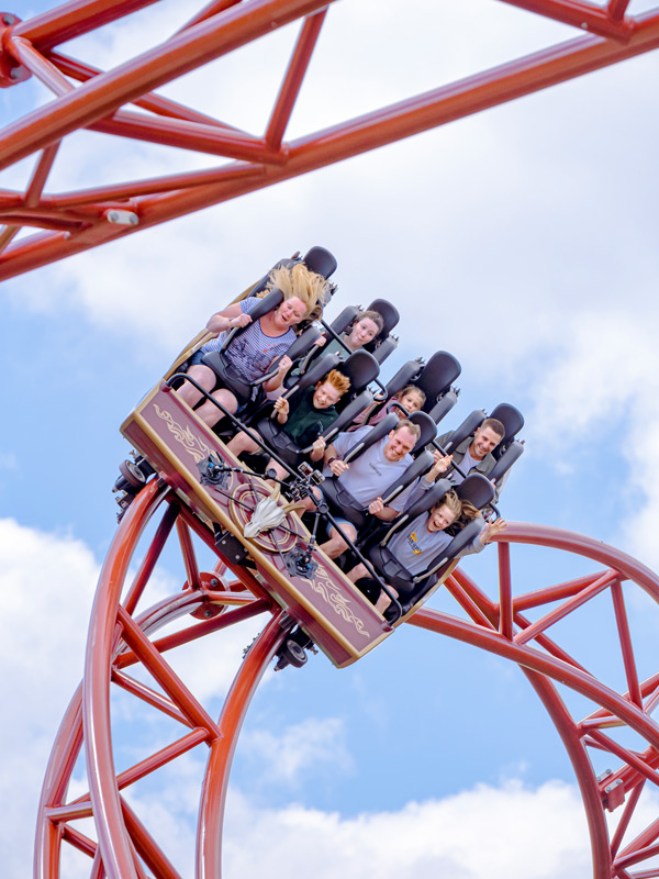 Family riders on the Drakon rollercoaster train at Paultons Park.