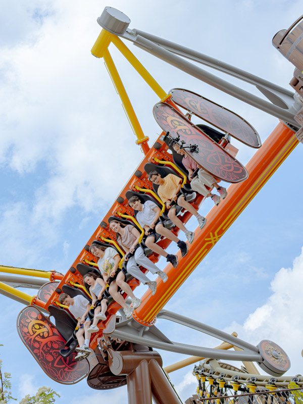 Riders swinging high overhead on Vild Swing at Paultons Park.