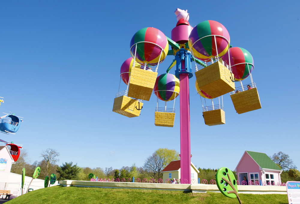 Peppa’s Big Balloon Ride with colourful balloon baskets flying at Peppa Pig World, Paultons Park.