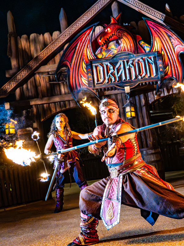 Halloween fire performers in front of Drakon at Paultons Park