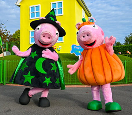Peppa Pig and George dressed in Halloween costumes in Peppa Pig World |