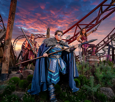 Valgard characters standing beside Drakon during Halloween at Paultons Park