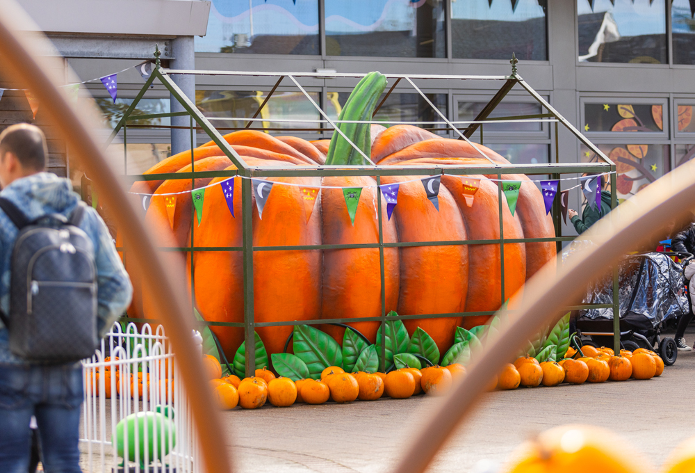 Peppa Pig World at Halloween decorated with a giant pumpkin and smaller pumpkins