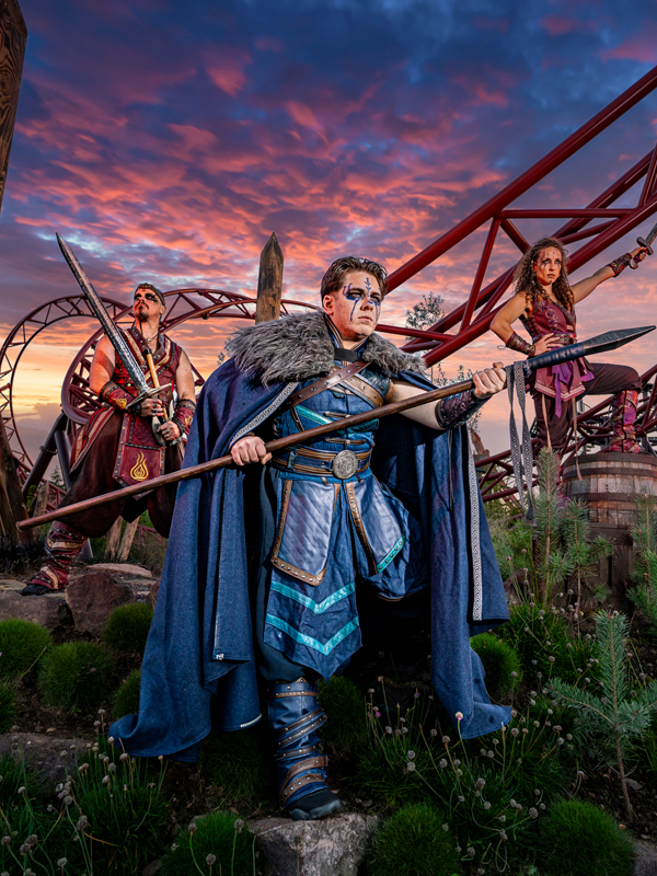 Paultons Park Valgard at Halloween featuring Viking warriors posing among the themed landscape and rollercoaster track